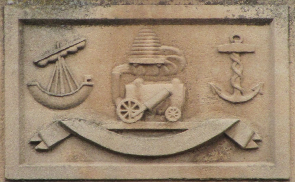 Troon Town Hall was completed in 1932, and above its front door is a stone panel bearing yet another representation of the locomotive. It has become a bizarre hybrid − grafted onto the tubby body of the Killingworth-type locomotive, with its vertical cylinders, are the asymmetric wheels and side-mounted cylinder of Robert Stephenson’s Rocket.